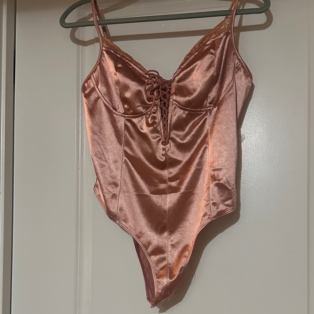Charlotte Russe  Pink bodysuit Lace-Up L